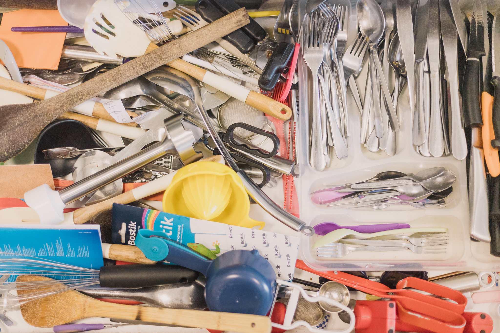 Before Sorted kitchen utensil drawer