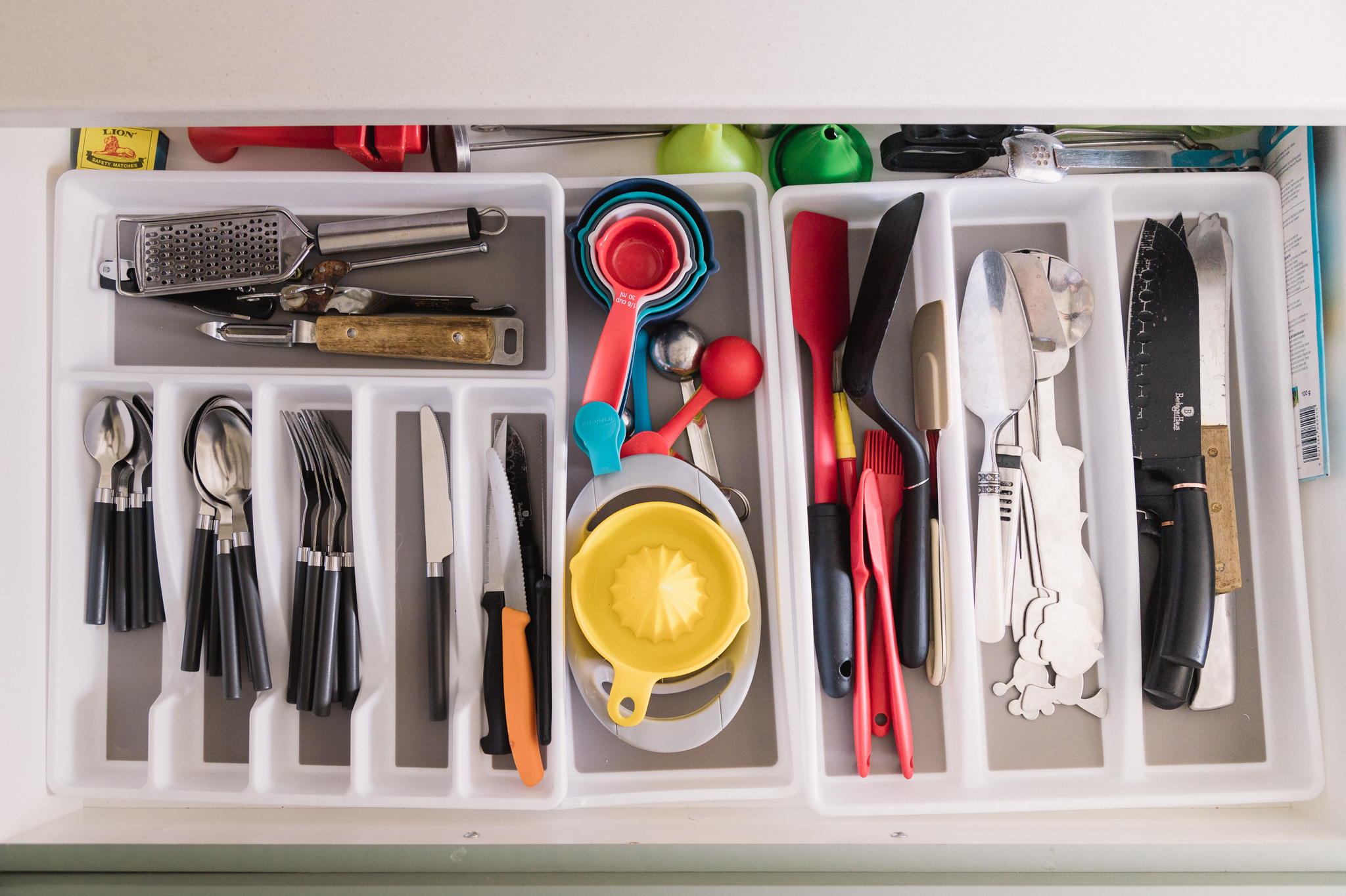 After Sorted kitchen utensil drawer