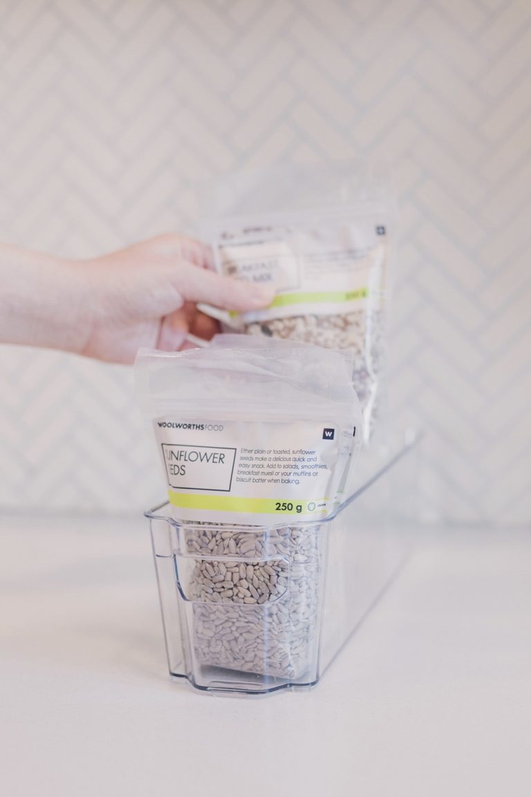 Hand Sorting health foods in container